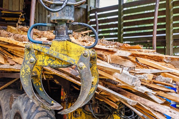 Hydraulic Crane on a forestry vehicle forwarder to lifting logs