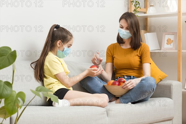 Mom girl couch with fruits