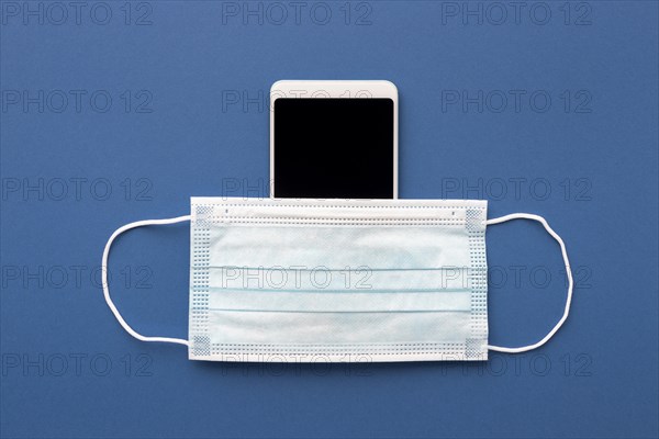 Flat lay medical mask smartphone