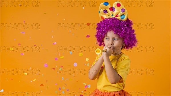 Girl with confetti clown costume