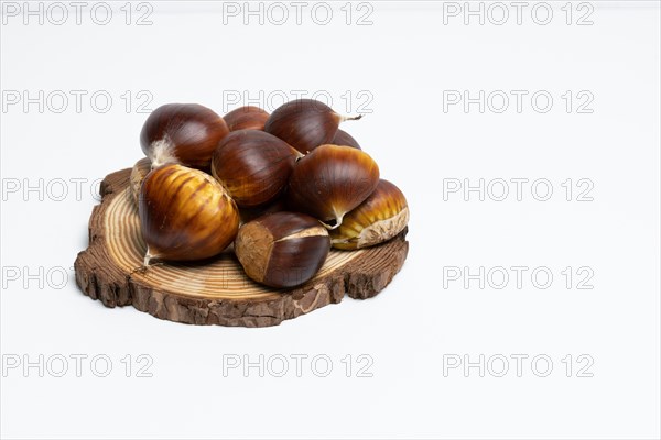 Seasonal chestnuts harvested from the field on a white background