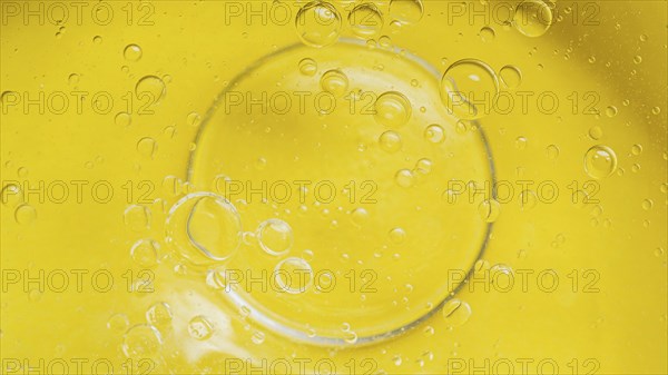 Top view yellow liquid background