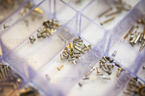 Screws for temples of glasses in a box at an optician's