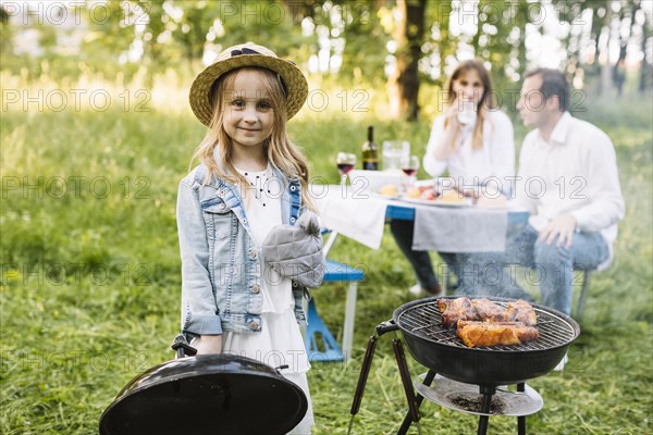 Family doing barbecue nature