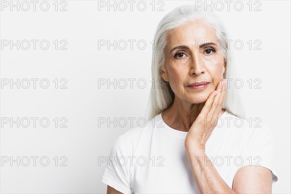 Front view senior woman looking camera