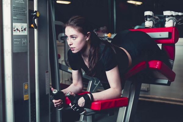 Sporty woman doing fitness exercise gym