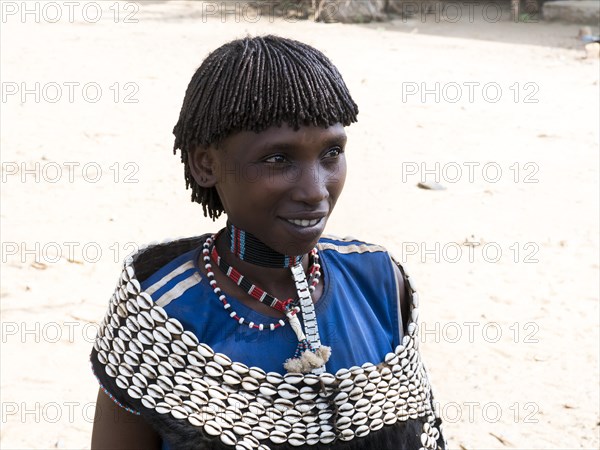 Woman with shell jewellery from the Tsamay tribe