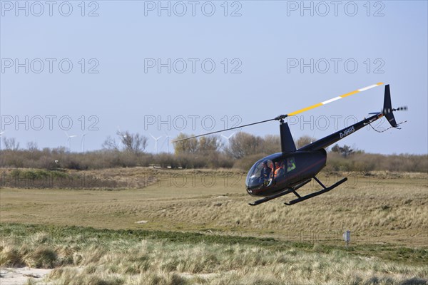 Helicopter over the island of Minsener Oog