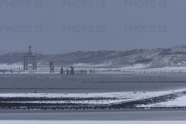 View from the island of Minsener Oog to Wangerooge in winter