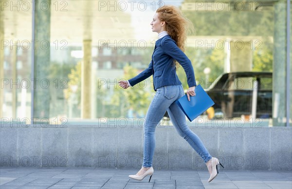 Businesswoman running high heels