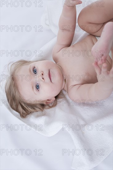 Baby posing with white towel