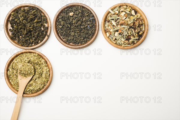 Various assorted natural medical dried herbs wooden tray