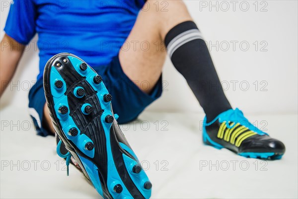 Football player relaxing shoe view