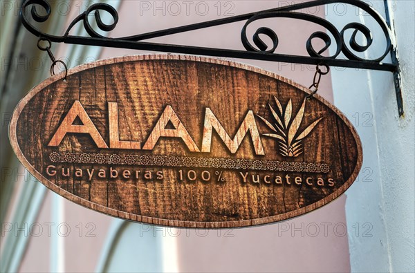 Sign for Guayaberas Alam clothes shop