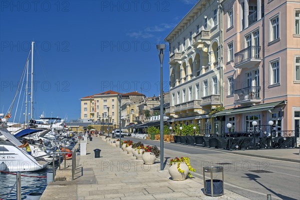 Sailing boats and yachts along promenade in the town Pore?