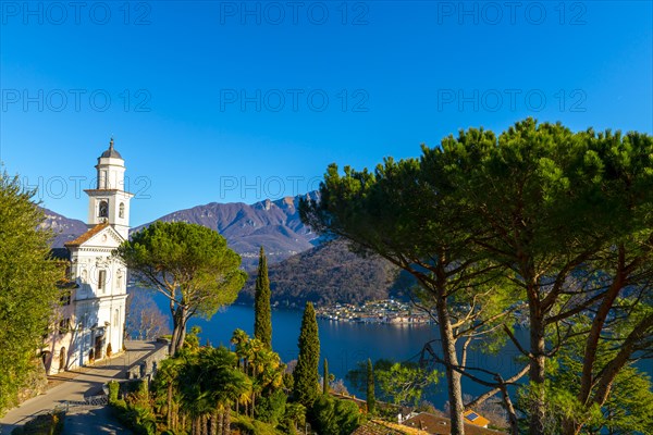 Church of Saints Fedele and Simone and Lake Lugano with Mountain in a Sunny Day in Vico Morcote