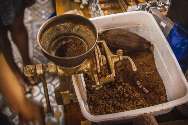 Grinding Natural Chocolate Roasted Cocoa on Roatan Island. Honduras