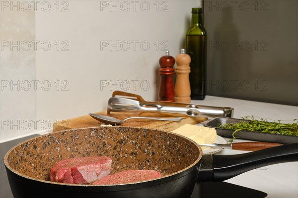 Frying top sirloin beef steak in the kitchen