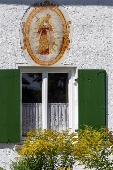 Facade with Christian fresco and and window in the Swabian Open Air Museum