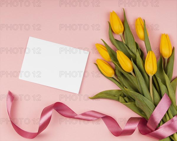Assortment yellow tulips with empty card