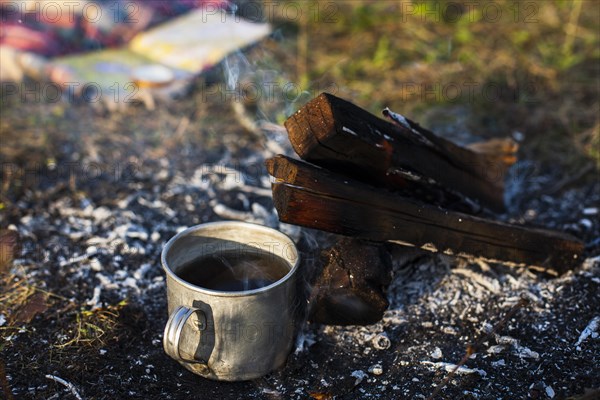 Cup with coffee extinguish fire