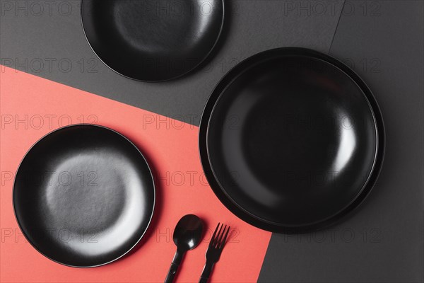 Flat lay black plates composition