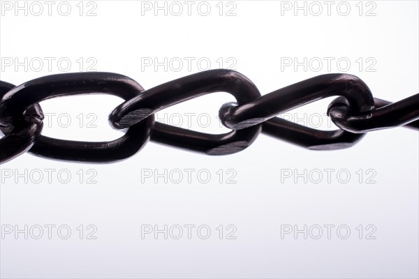 Metal chain on white background