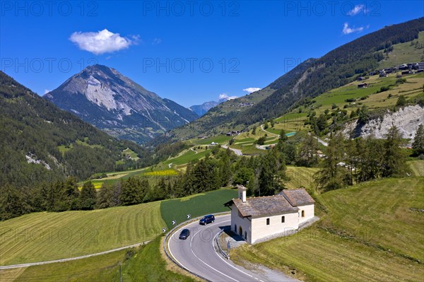 Summer landscape with Saint-Laurent chapel on the ascent to the Great St Bernard Pass