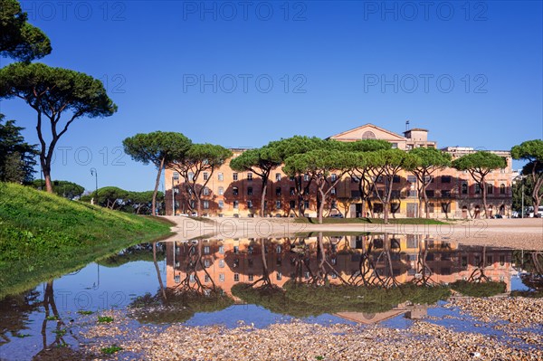Reflection of a building in a water pool at Circus Maximus