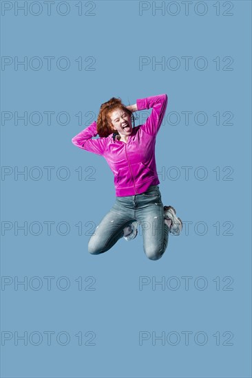 Happy young woman jumping 16