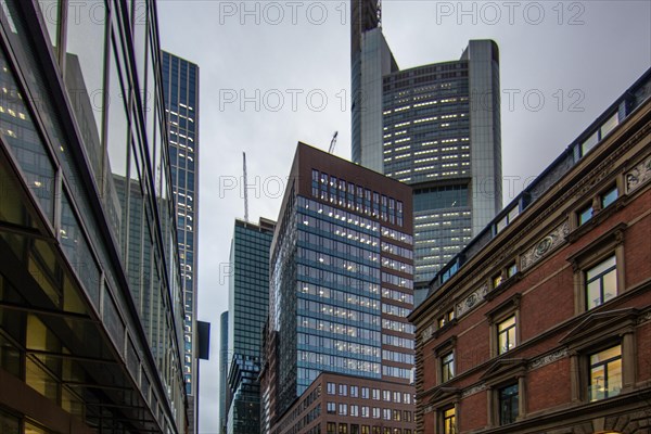 Sunset between skyscrapers. Cityscape with modern office buildings and streets. Insurance companies and banks as a cityscape in Frankfurt am Main