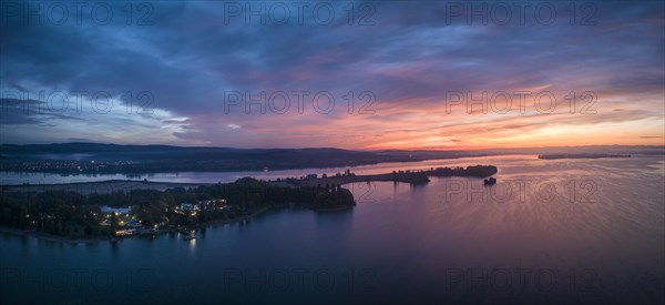 Aerial panorama of western Lake Constance in front of sunrise with the Mettnau peninsula