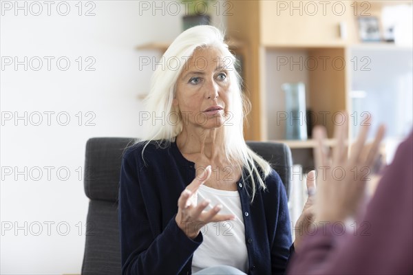Therapist talking to a patient in a practice