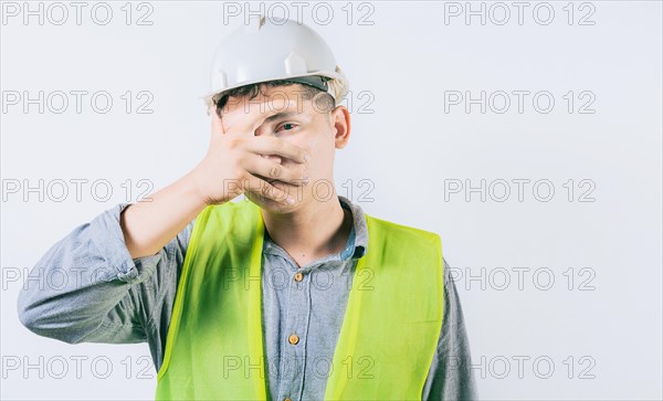 Man engineer with irritated eyes isolated. Young engineer with conjunctivitis on isolated background
