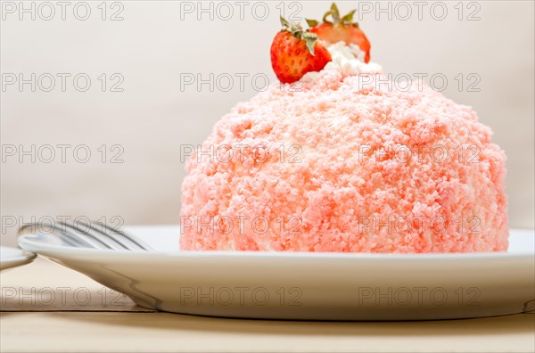 Fresh pink strawberry and whipped cream dessert macro close up