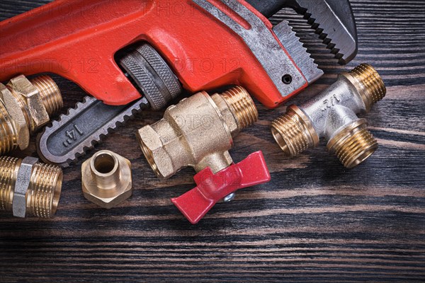 Composition of plumbing tools on wooden board horizontal version