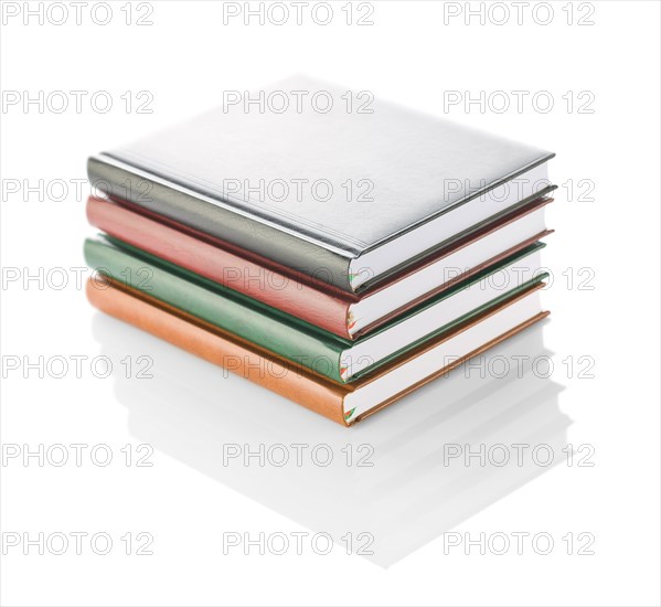 Stack of four diaries isolated