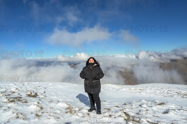 Portrait young latina woman in the snow