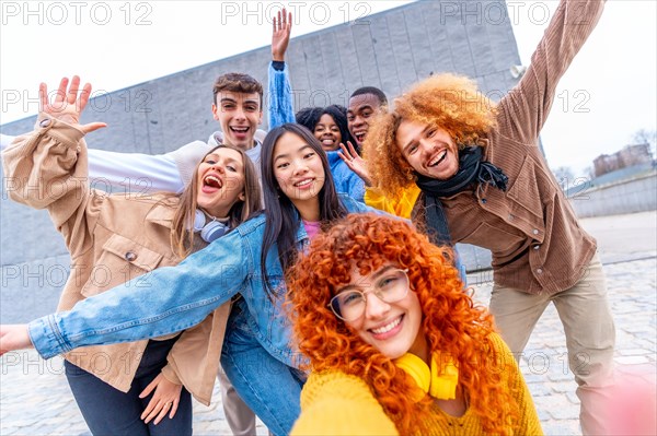 Funny selfie of a multi-ethnic group of people in an urban space