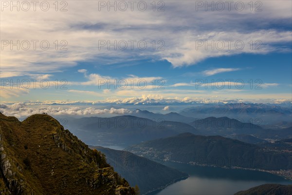 Aerial View over Beautiful Mountainscape with Snow Capped Mountain and Cloudscape and Lake Lugano in a Sunny Day From Monte Generoso