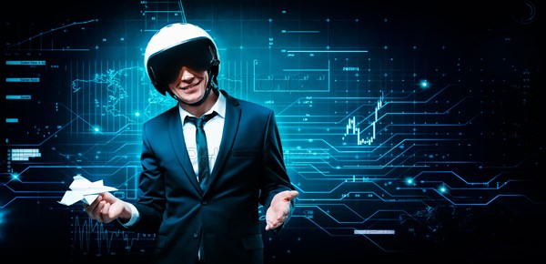 Portrait of a man in a helmet standing on the background of a futuristic hologram. Design concept.