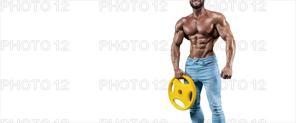 No name sexy muscular man in jeans posing on white background with dumbbell. Bodybuilding and fitness concept.