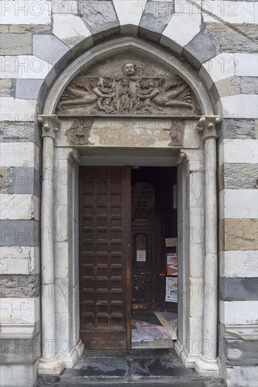 Side portal of the Romanesque Chiesa Parrocchia Abbazia di San Stefano, mentioned in 920, Piazza Santo Stefano, 2, Genoa, Italy, Europe