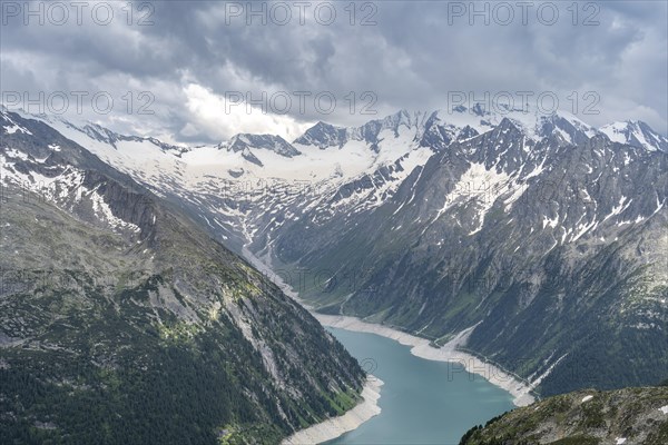 Mountain landscape, view of Schlegeis reservoir with dam wall, glaciated rocky mountain peaks Hoher Weisszint and Hochfeiler with Schlegeiskees glacier, Berliner Hoehenweg, Zillertal Alps, Tyrol, Austria, Europe