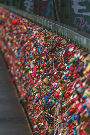 A multitude of colourful love locks attached to a bridge railing, Hohenzollern Bridge, Cologne Deutz, North Rhine-Westphalia, Germany, Europe