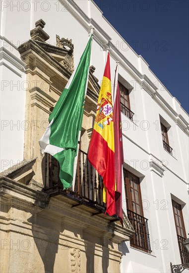 Flags outside the Ayuntiamiento, Plaza del Cabildo, village of Arcos de la Frontera, Cadiz province, Spain, Europe