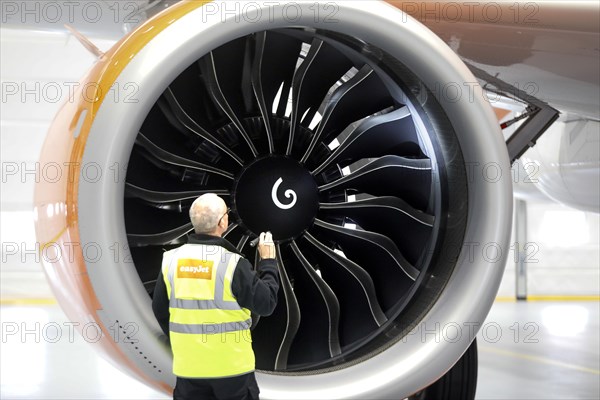 Olaf Gross, Licence Engineer at easyJet, checks the engine of an Airbus A320 Neo in front of the opening of the new easyJet maintenance hangar at Berlin Brandenburg Airport, BER. The entire European easyJet fleet is maintained at the Schoenefeld site