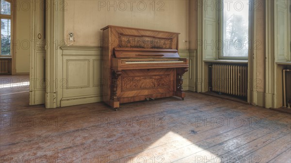 An old piano in a room with a wooden floor and large windows through which sunlight falls, Villa Woodstock, Lost Place, Wuppertal, North Rhine-Westphalia, Germany, Europe