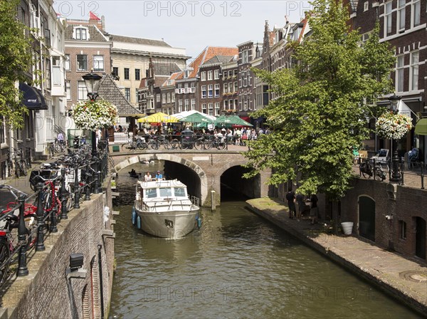 Pleasure boat on Oudegracht canal in central Utrecht, Netherlands