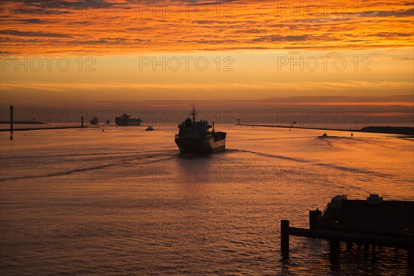 Sunset orange glow landscape clouds water, North Sea shipping, Port of Rotterdam, Hook of Holland, Netherlands